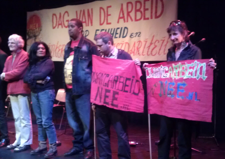 1 Mei in Amsterdam: Doorbraak-activiste namens comité Dwangarbeid Nee op het podium.